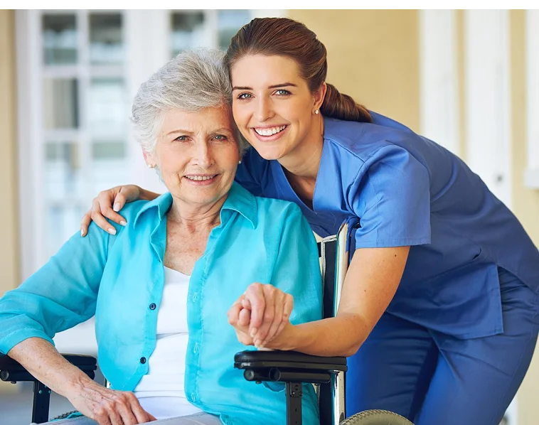 Caregiver with senior woman in wheelchair