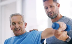 Senior man doing arm exercises