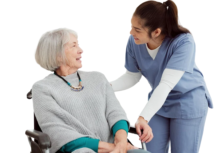 Caregiver assisting senior woman in wheelchair