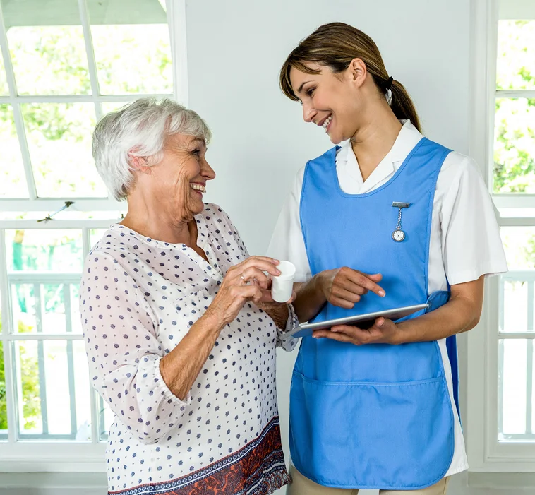 Caregiver assisting senior woman